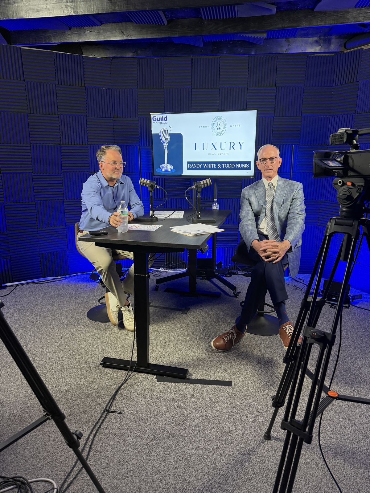 Two-person interview on the blue set at studioUSA West with cameras on tripods