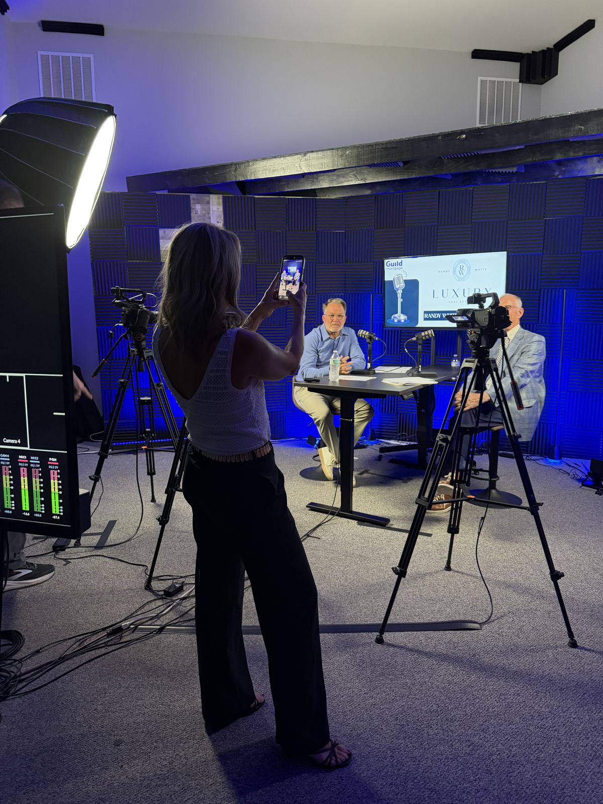 Phone content being captured alongside the studio cameras during an interview at studioUSA West